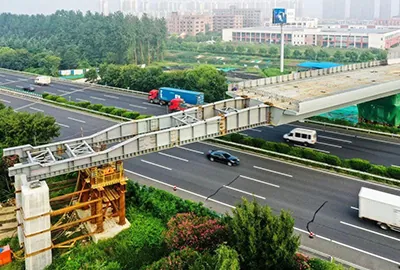 Synchronous lifting of steel box girder across highway